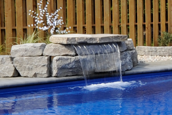 a waterfall integrated into a pool